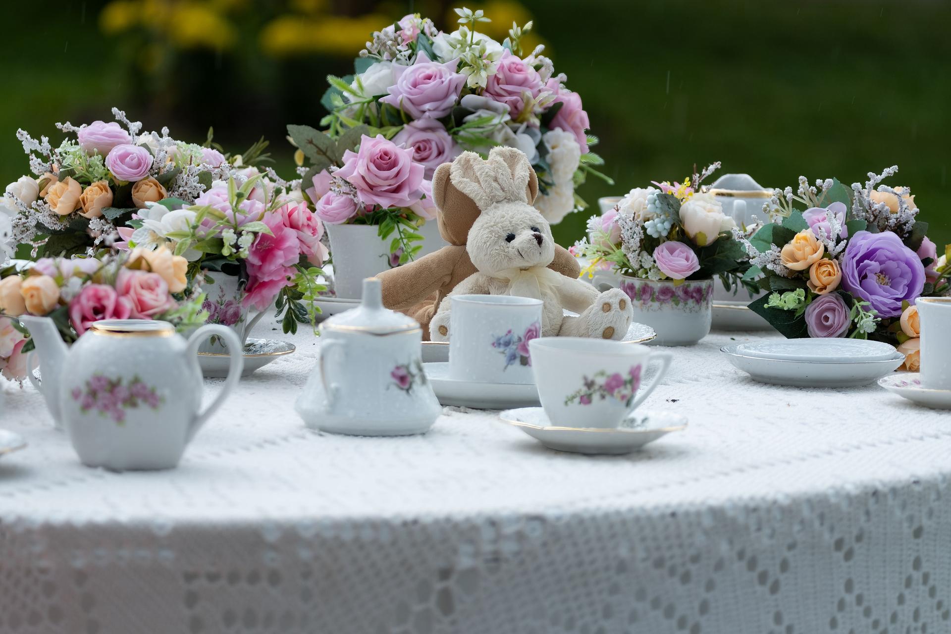Elegant Tea Party Setup with Floral Arrangements